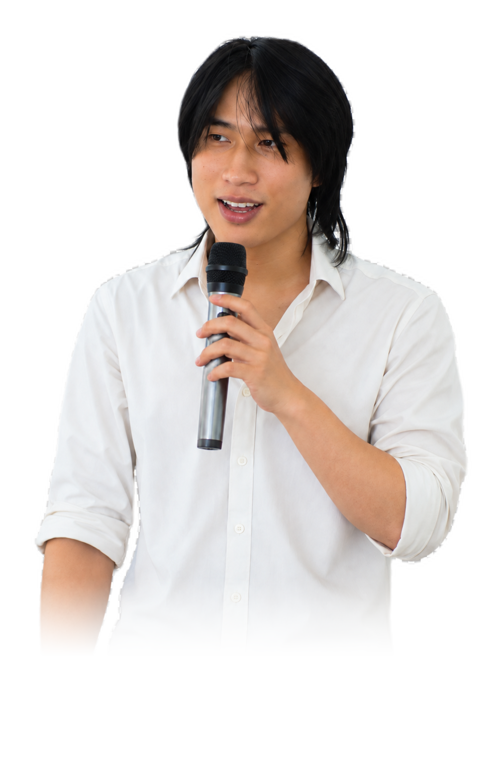 Buta speaking about AI systems while holding a microphone